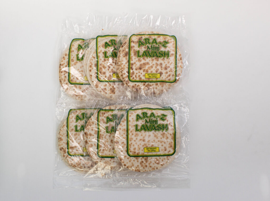 ARA-Z Mini Lavash 6-pack by Breadmasters - Artfully arranged stack of thin, soft, and pliable traditional Persian-style mini flatbreads, each approximately 8 inches in diameter, displayed on a rustic surface | Perfect for quick wraps, mini pizzas, and dipping | Made with organic wheat flour, water, sea salt, and olive oil | Vegan-friendly and preservative-free