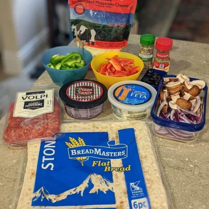 Flatbread-Pizza-stone-lavash-flatbread-recipe-araz-arazlavash-breadmasters-breadmasters.com-2-1-1024x1024 - Breadmasters BreadMasters lavash flatbread with pizza ingredients including pepperoni, mozzarella, feta, peppers, mushrooms and seasonings for homemade Armenian flatbread pizza