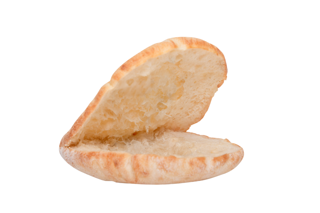 Open Old Country Pocket pita bread from Breadmasters - Split view showing the interior pocket cavity of traditional thicker, denser pocket bread, ready to be stuffed with falafel, gyros, salads, or other fillings | Soft, fluffy texture with golden-brown exterior, made with time-honored methods