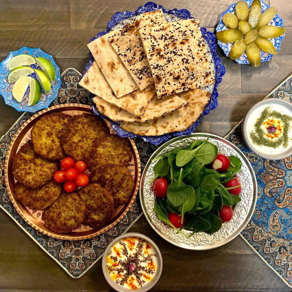 Toasted-ARA-Z-Sangak-Flatbread-Sesame-and-Multi-Seed-Assortment - BreadMasters Toasted ARA-Z Sangak flatbread assortment - Sesame seed and multi-seed slices of traditional Persian stone-baked bread, golden-brown and crispy | Perfect for dipping, spreads, or enjoying with cheese as suggested on the product page | Vegan Non-GMO Kosher from Breadmasters