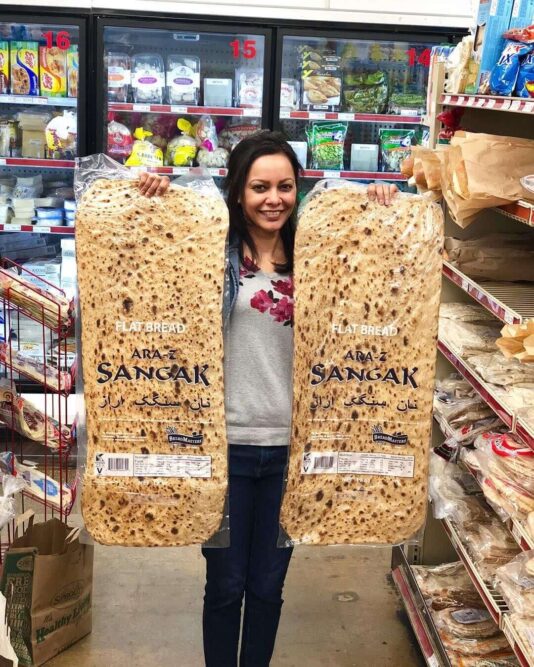 Toasted-Sangak-Flatbread-Sesame-and-Multi-Seed-Assortment-Breadmasters - Breadmasters Toasted ARA-Z Sangak flatbread assortment - Sesame seed and multi-seed Persian stone-baked bread slices, golden-brown and crispy, arranged on a dark surface | Traditional Iranian flatbread perfect for dipping, spreads, or enjoying with cheese | Vegan Non-GMO Kosher from Breadmasters